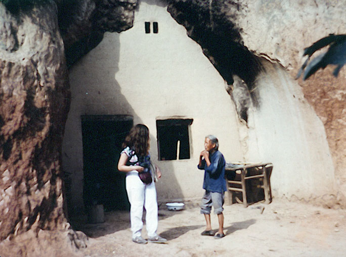 Sarah, woman, and cave house